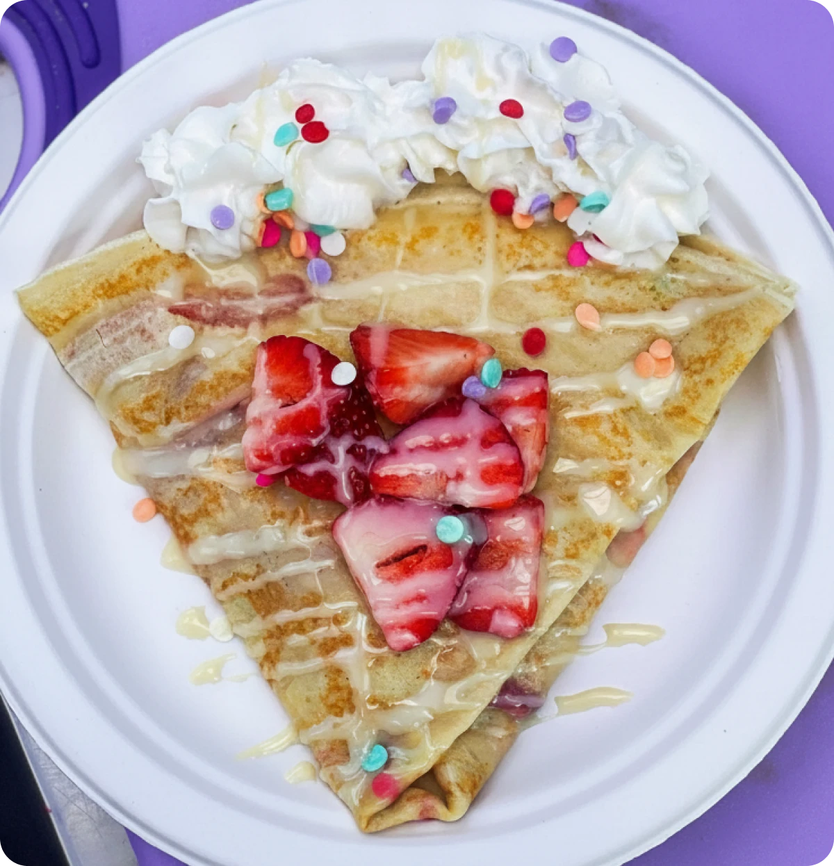 Crepe with strawberries and whipped cream